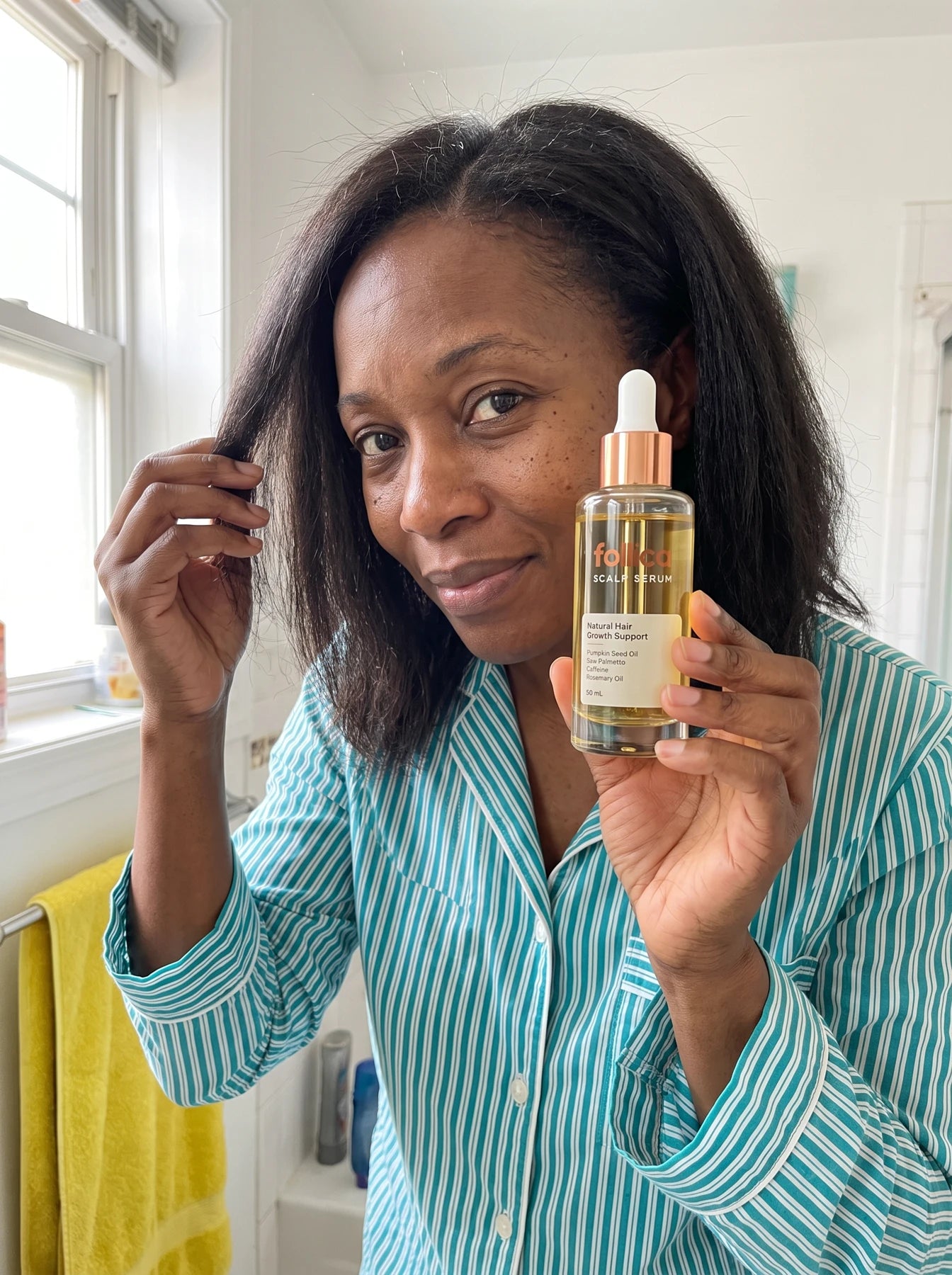 Black woman holding Follica
